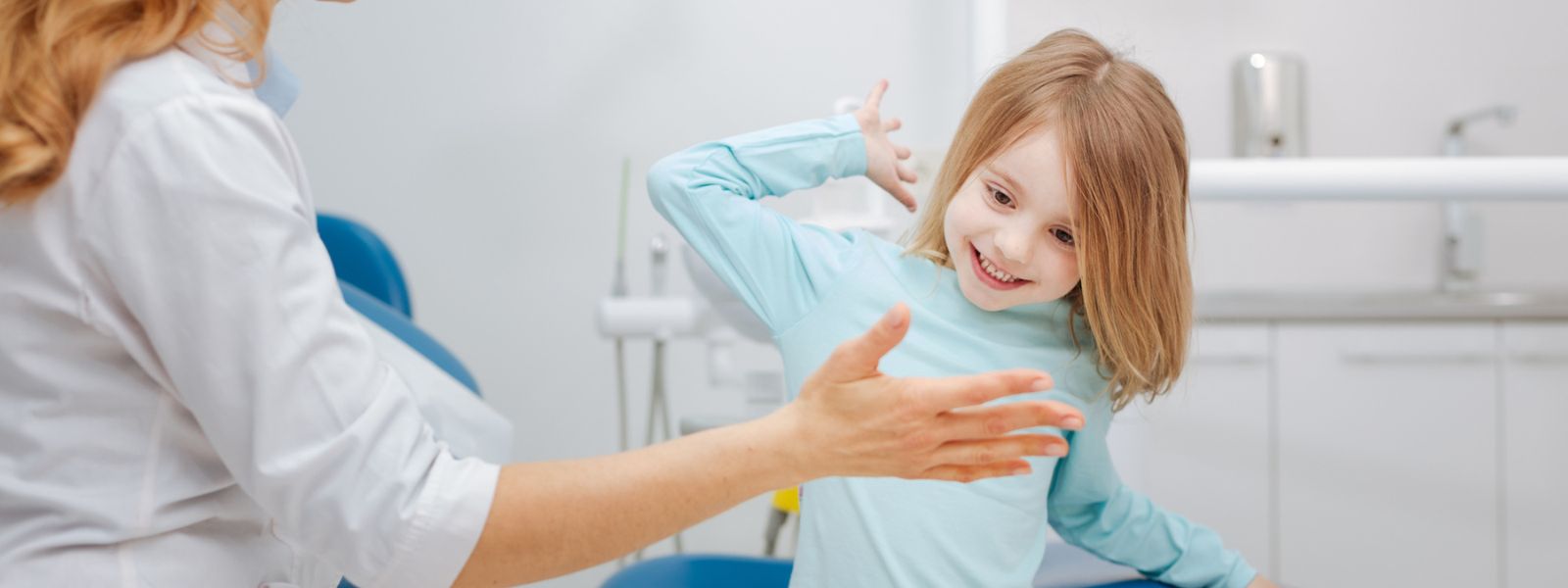 Small kid playing happily with Dentist
